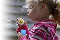 Child blowing bubbles